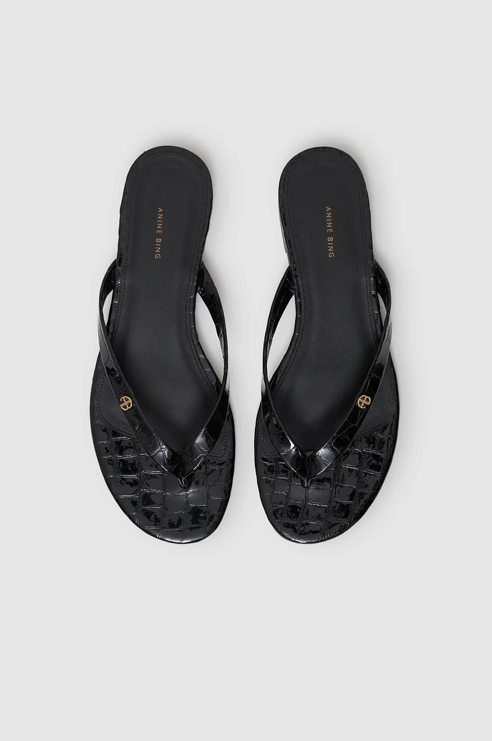 Noelle Thong Sandals in Embossed Black