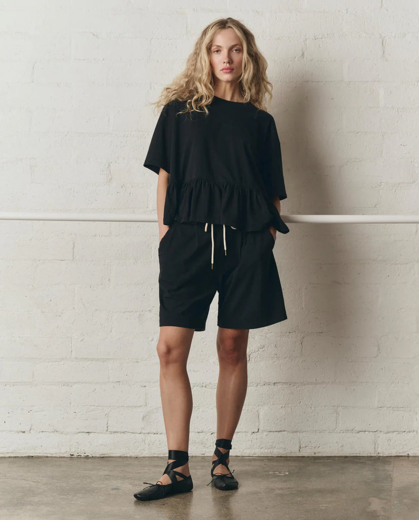 The Oversized Ruffle Peplum Tee. True Black