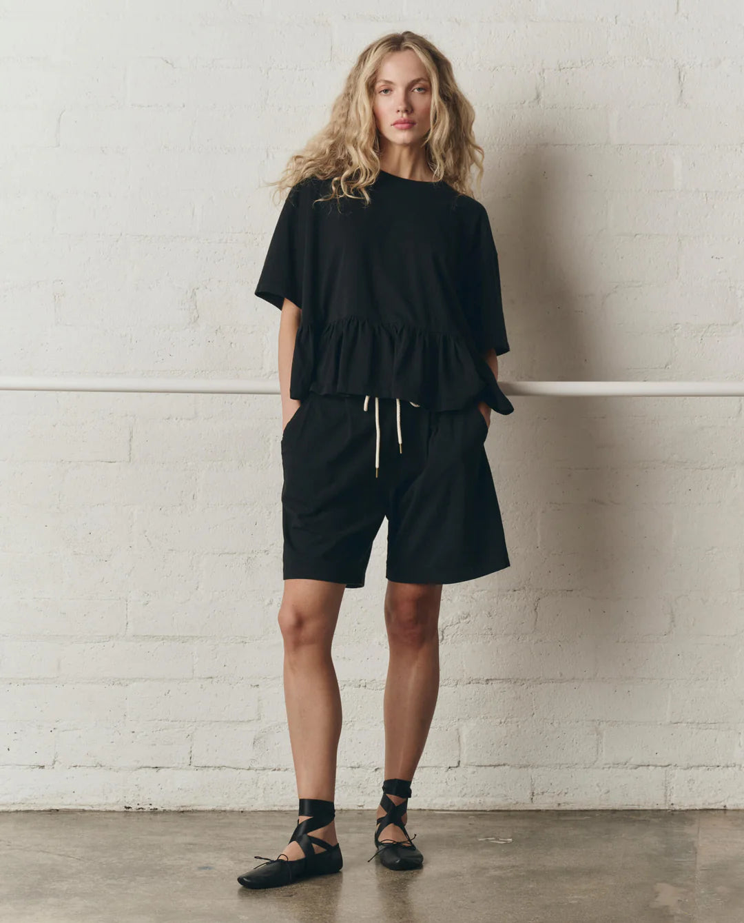 The Oversized Ruffle Peplum Tee. True Black